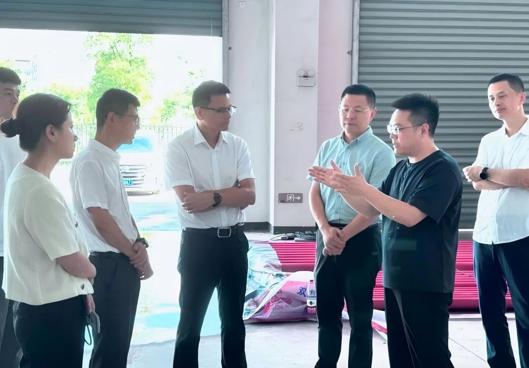 Officials discussing DoGo Power technology during a visit 